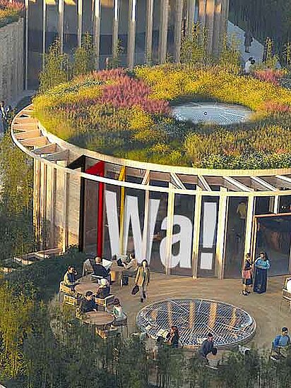 Runder Deutscher Pavillon auf der Expo 2025 in Osaka aus der Vogelperspektive mit begrüntem Dach und Bäumen in der Umgebung